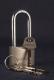 Disk padlock with a prolonged shackle